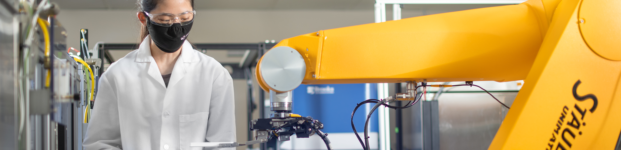 scientist using a big machine in a lab